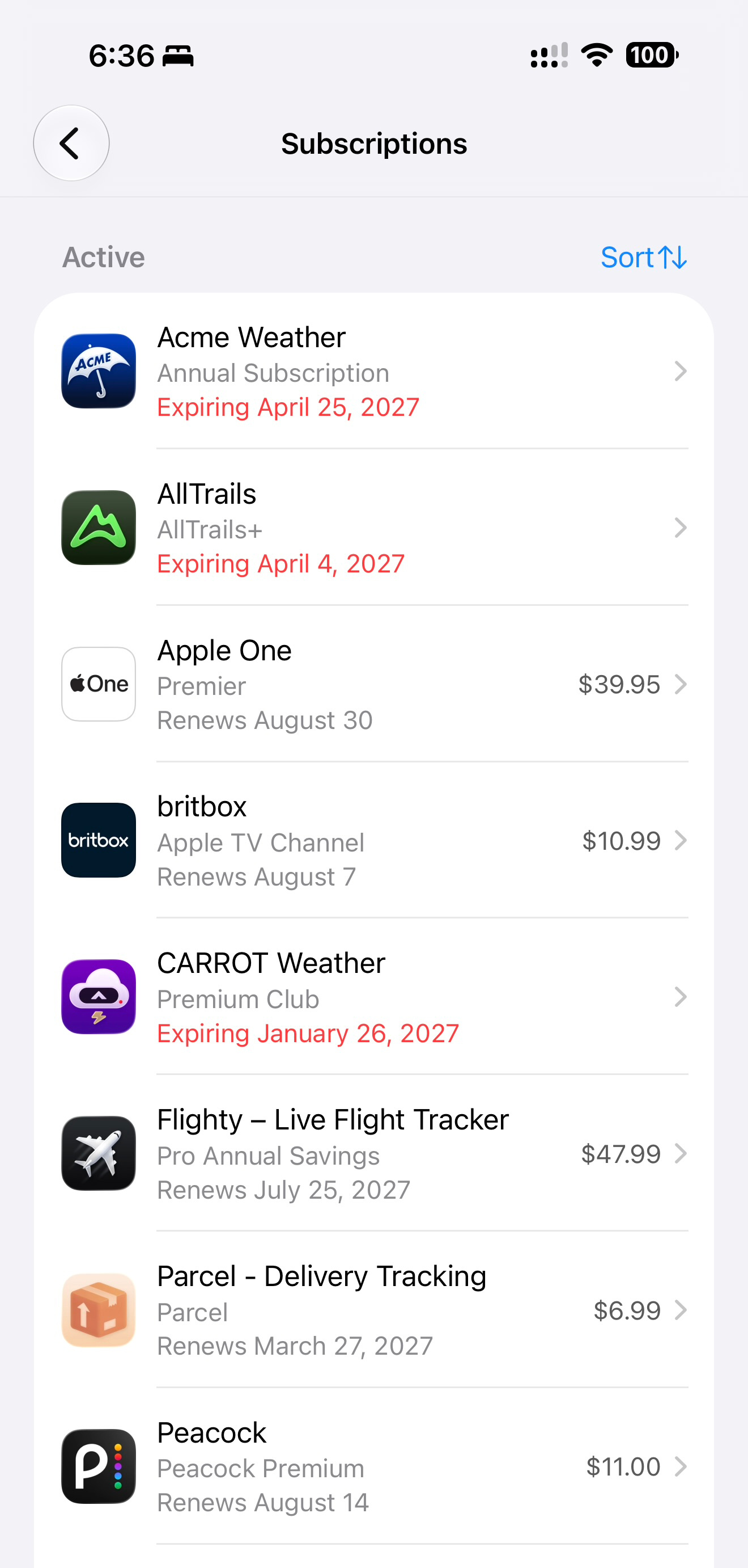 The Subscriptions screen on an iPhone showing active plans with renewal and expiration dates