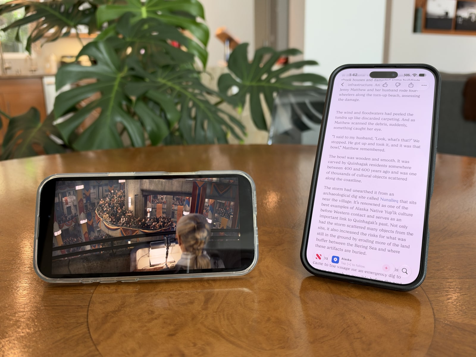 Clear iPhone 16 Pro case holding a phone horizontally for video and black iPhone 16 Pro Max case holding a phone vertically for reading.