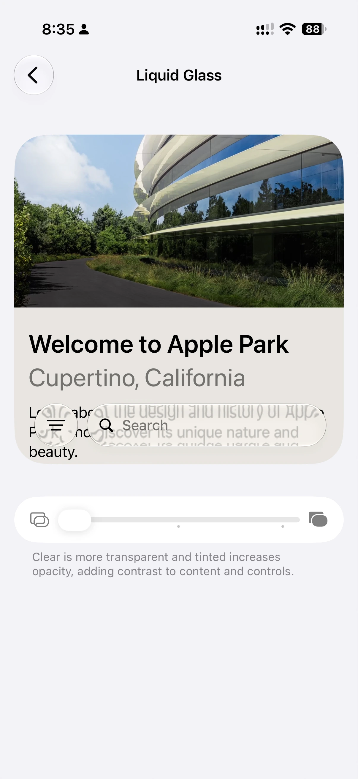 Liquid Glass slider at the clear end, with transparent menu and search controls.