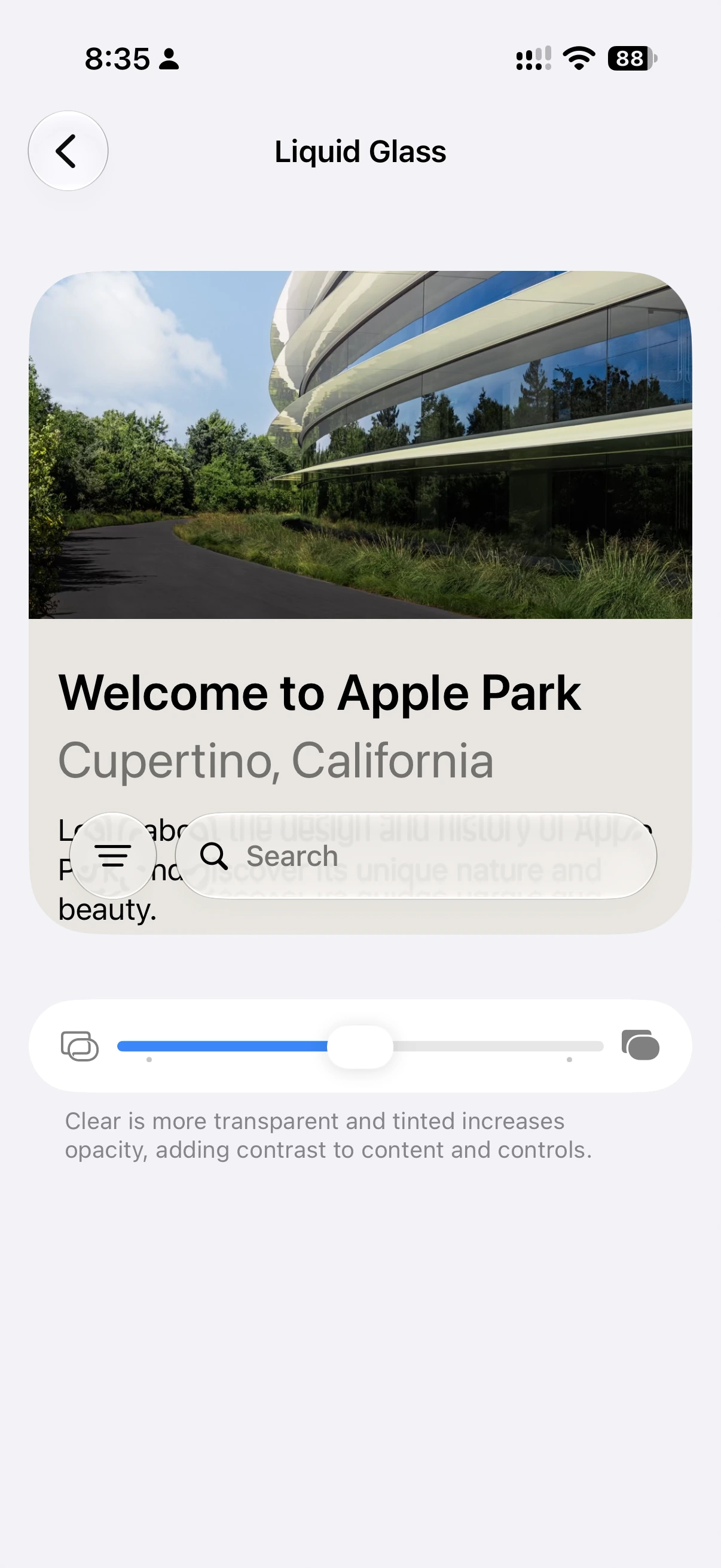 Liquid Glass slider near the middle, with some tint behind the menu and search controls.