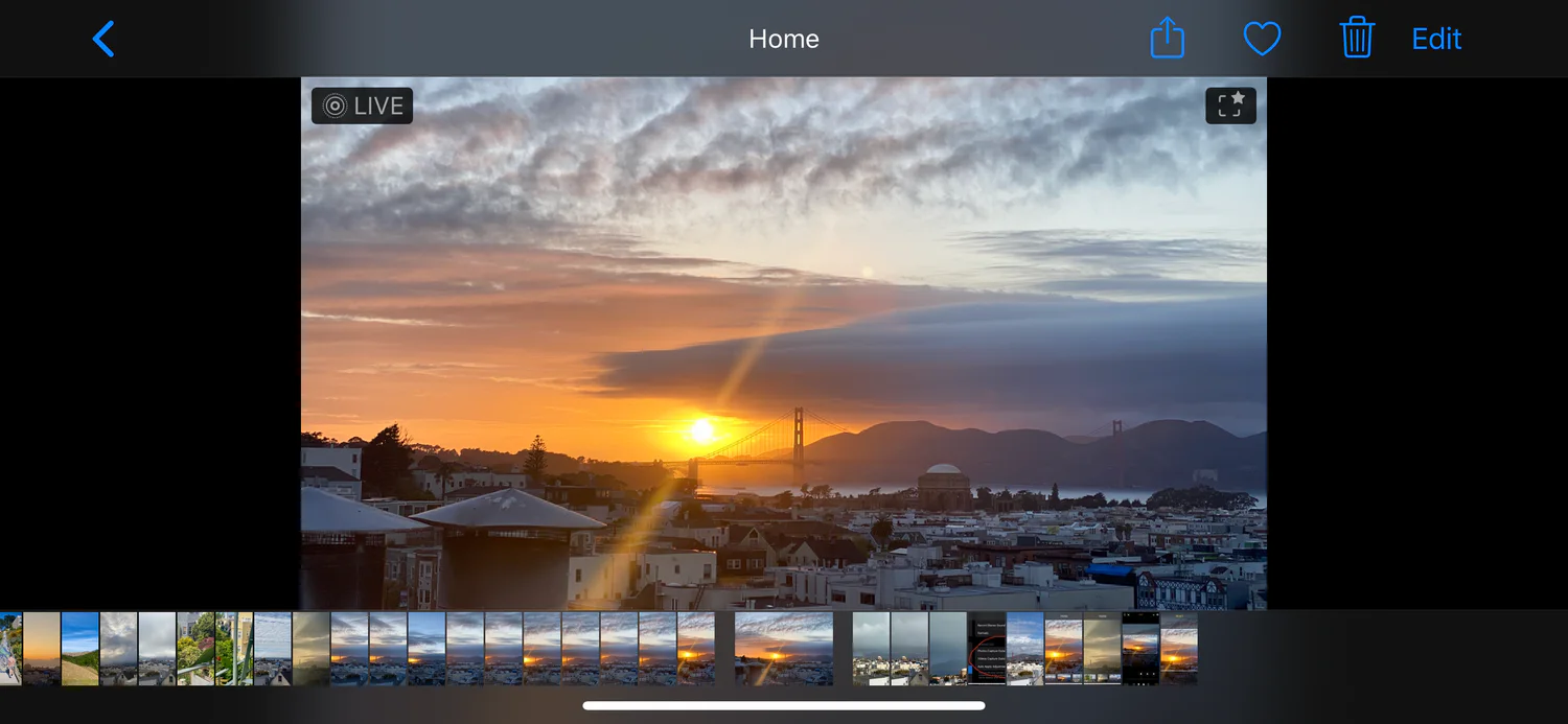 iPhone Photos app displaying an expanded sunset photo