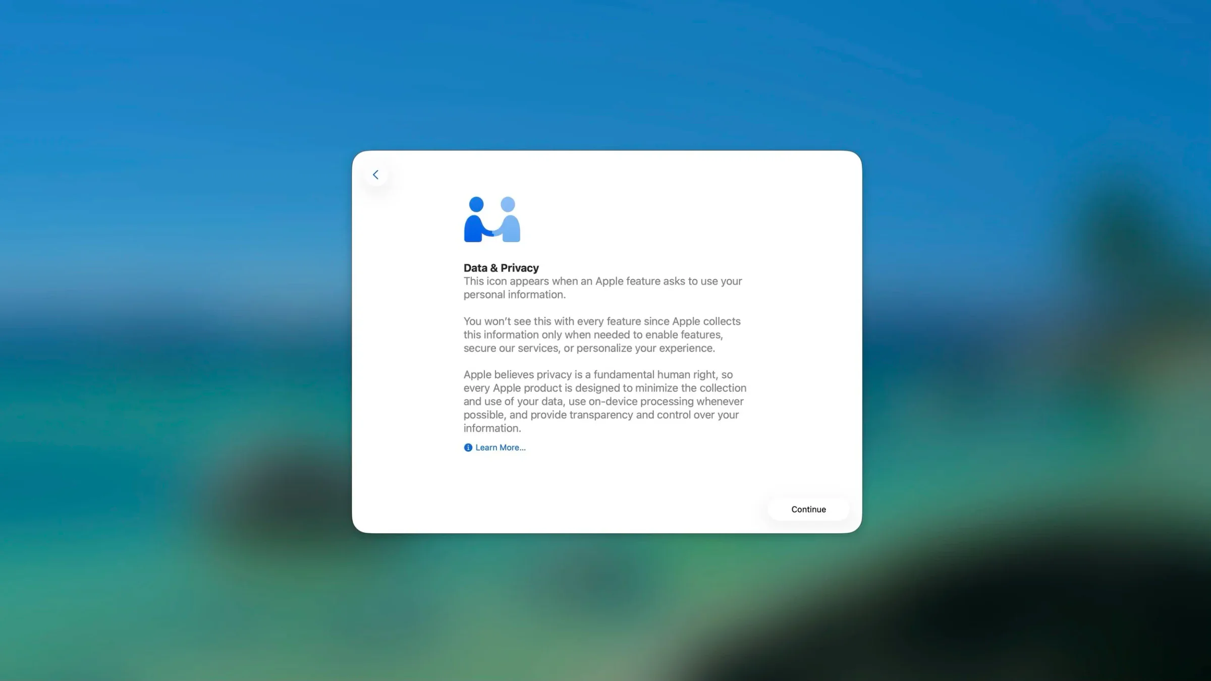 Apple privacy information screen with icon of two people shaking hands and text about data privacy and collection policies.