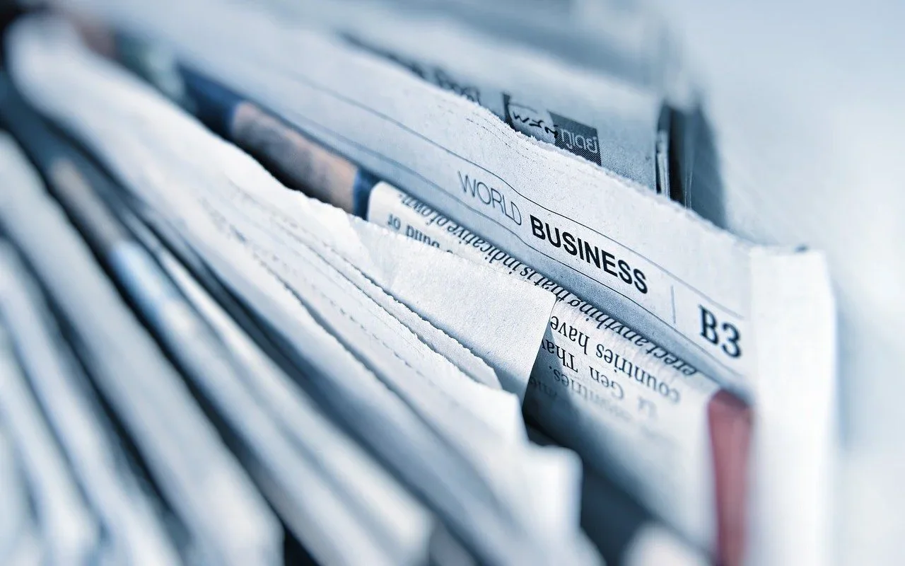 A crowded paper file with labeled dividers, representing too many open browser tabs
