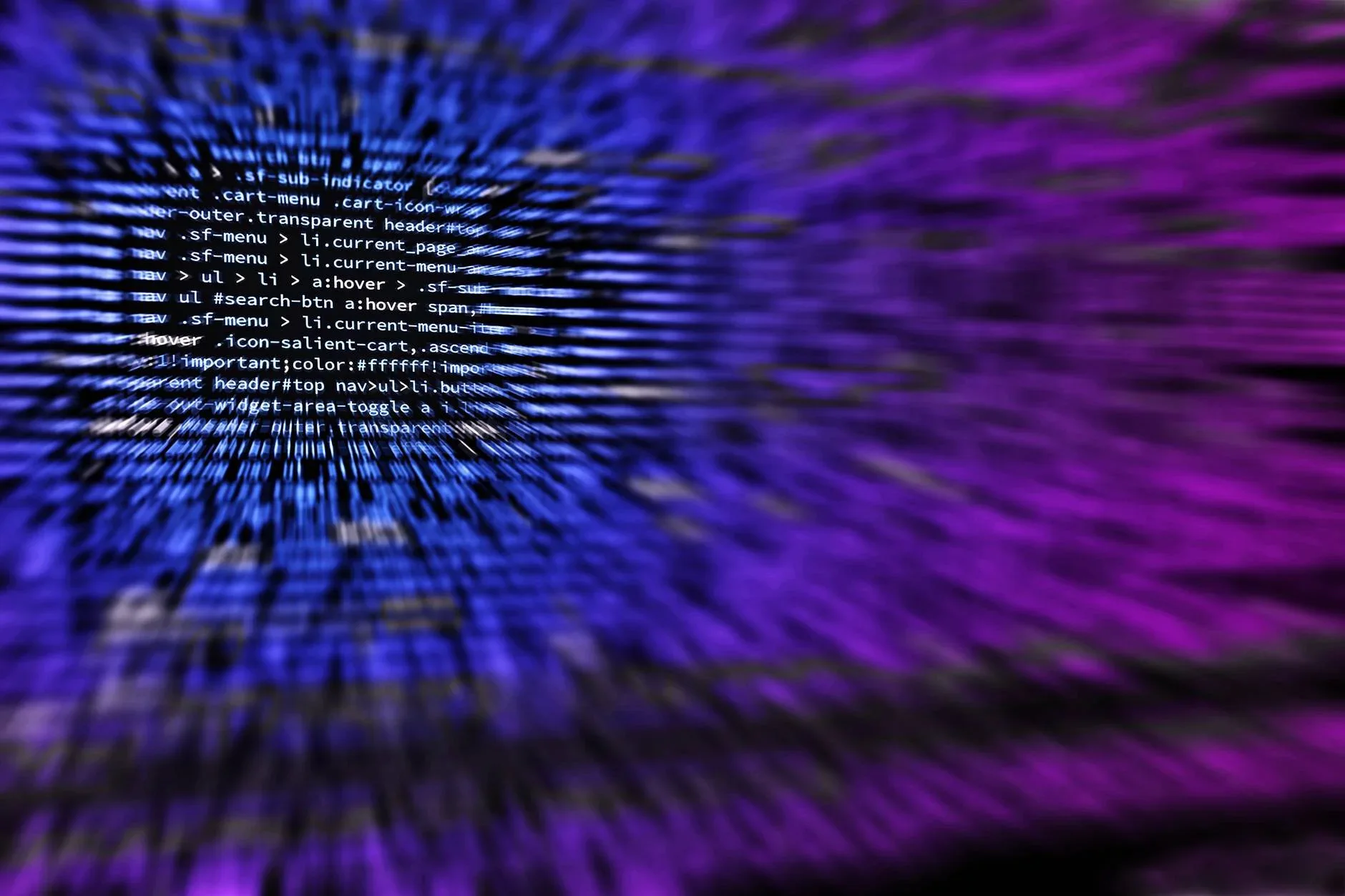 Computer code displayed across a screen, representing online scams