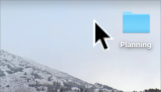 A large Mac pointer beside a folder on the desktop