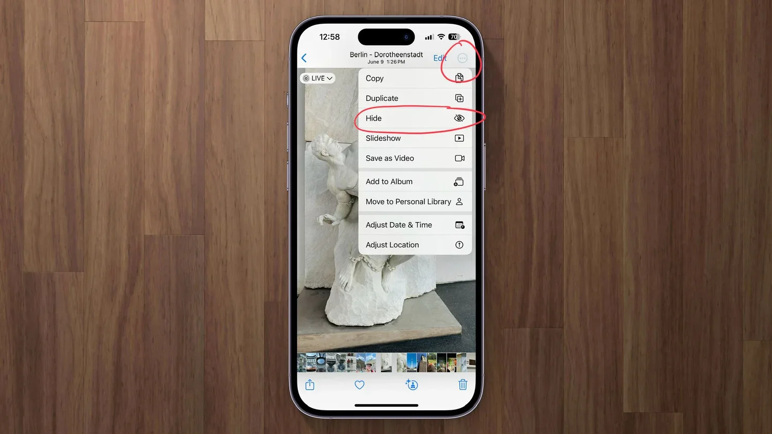 iPhone Photos menu with the Hide command highlighted