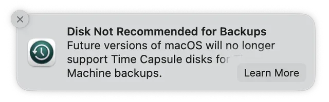 Screenshot of a banner on macOS: Disk Not Recommended for Backups. Future versions of macOS will no longer support Time Capsule disks for Time Machine Backups.
