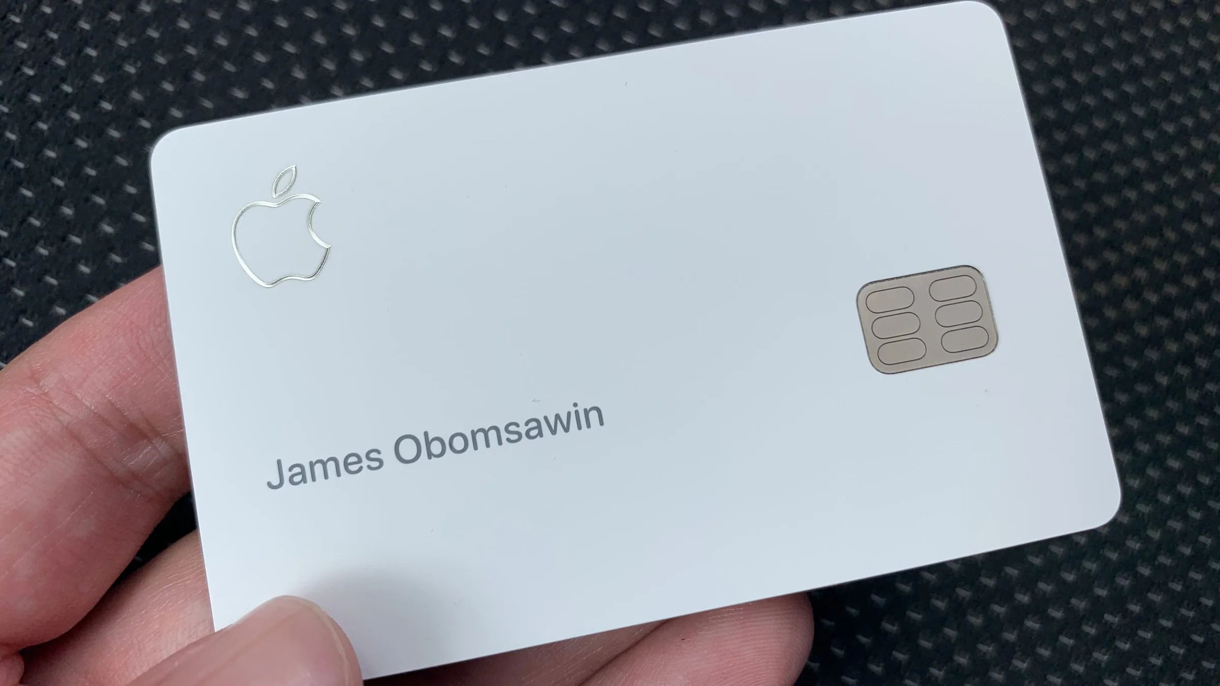 A titanium Apple Card with the name James Obomsawin