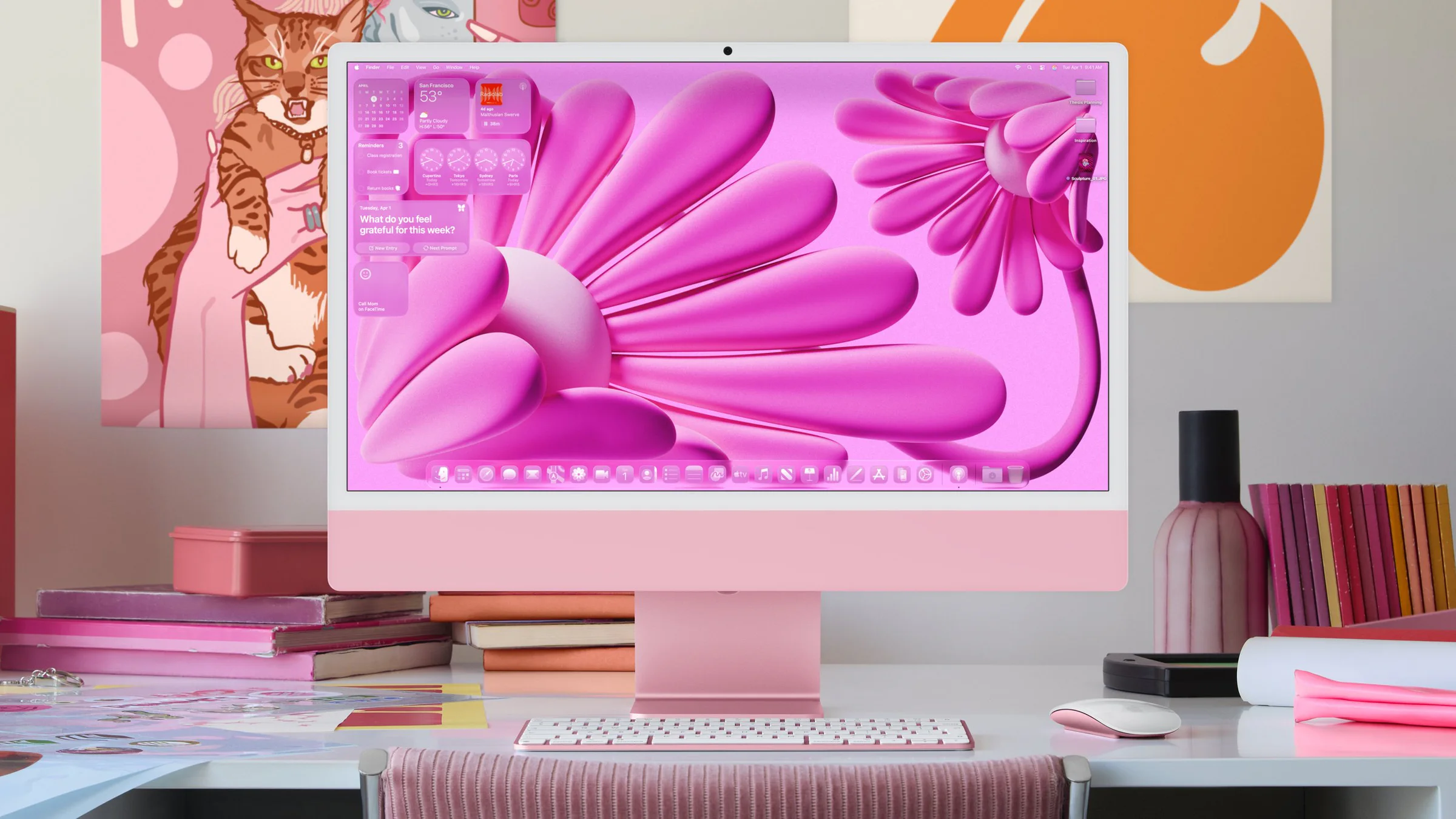 Colorful desktop setup displaying macOS Tahoe