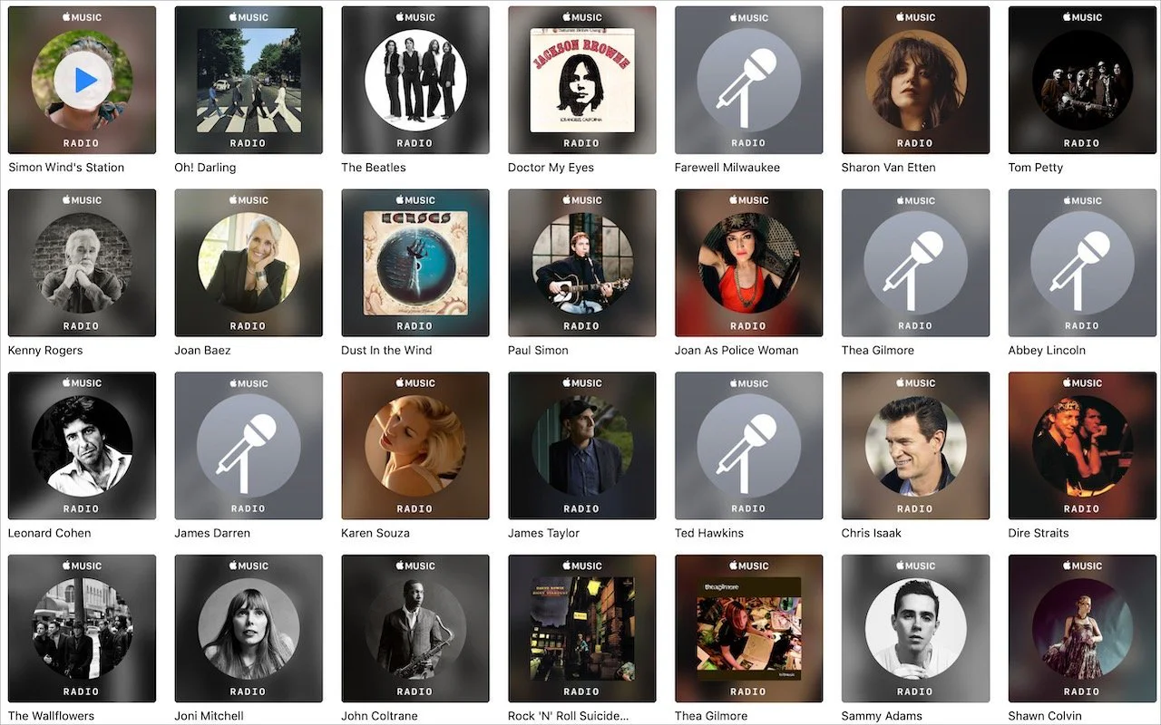 Apple Music artist grid with several radio microphone placeholders