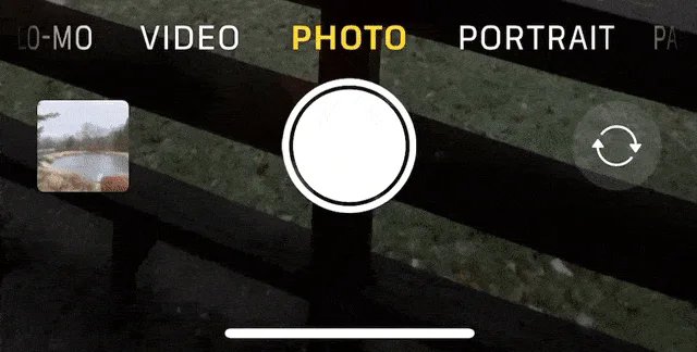 Animation of the iPhone Camera app shutter button being dragged to record video