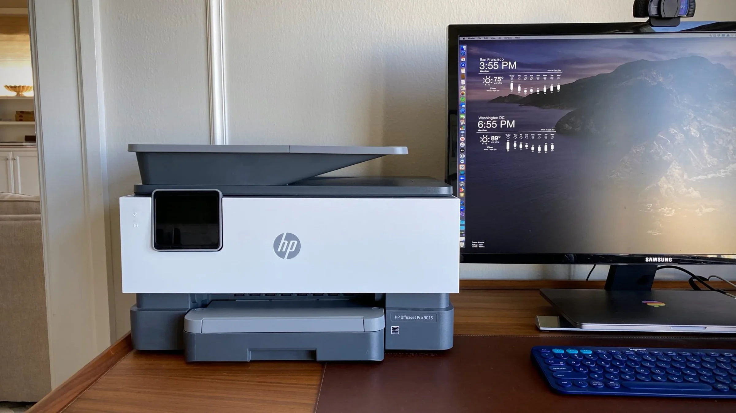 HP OfficeJet Pro 9015 printer beside a Mac display on Jimmy's desk