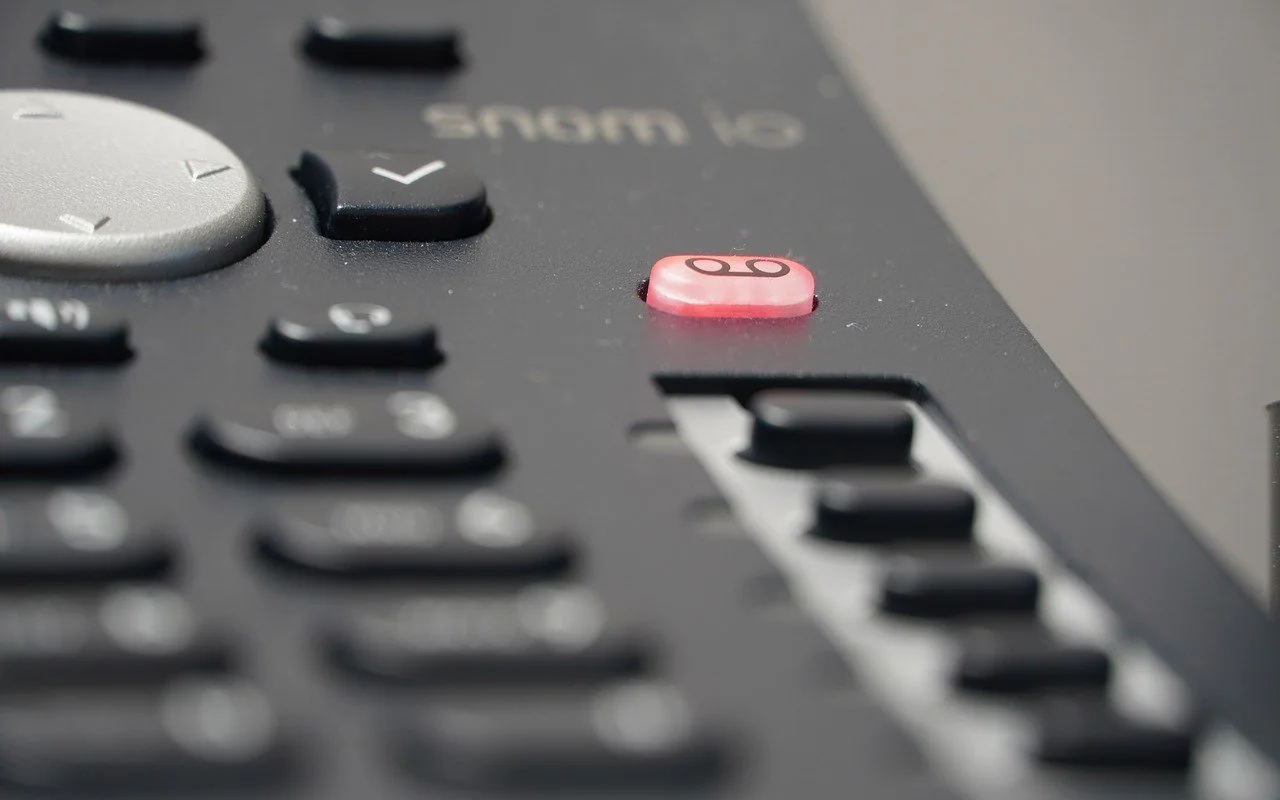 Close-up of the red record button on a telephone