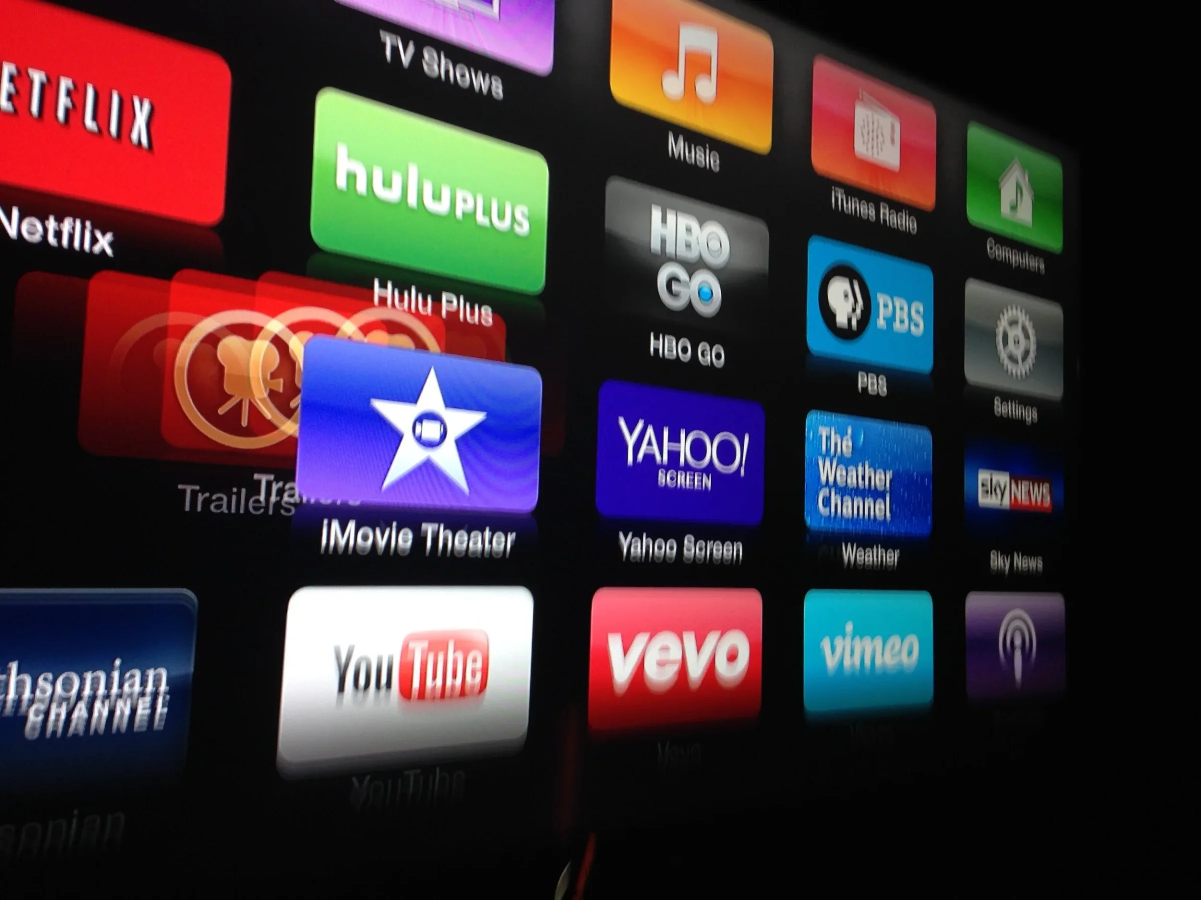 Apple TV home screen crowded with streaming app icons