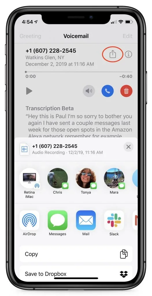 An iPhone voicemail screen with the Share button highlighted