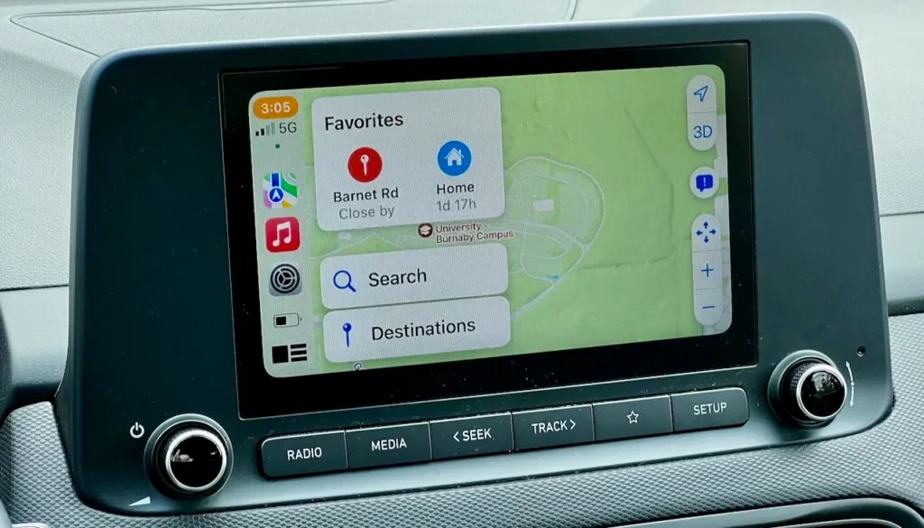 Apple CarPlay map screen with Favorites and search controls